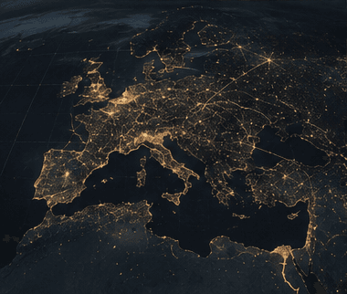Europe seen from orbit at night, city lights picking out the coastlines