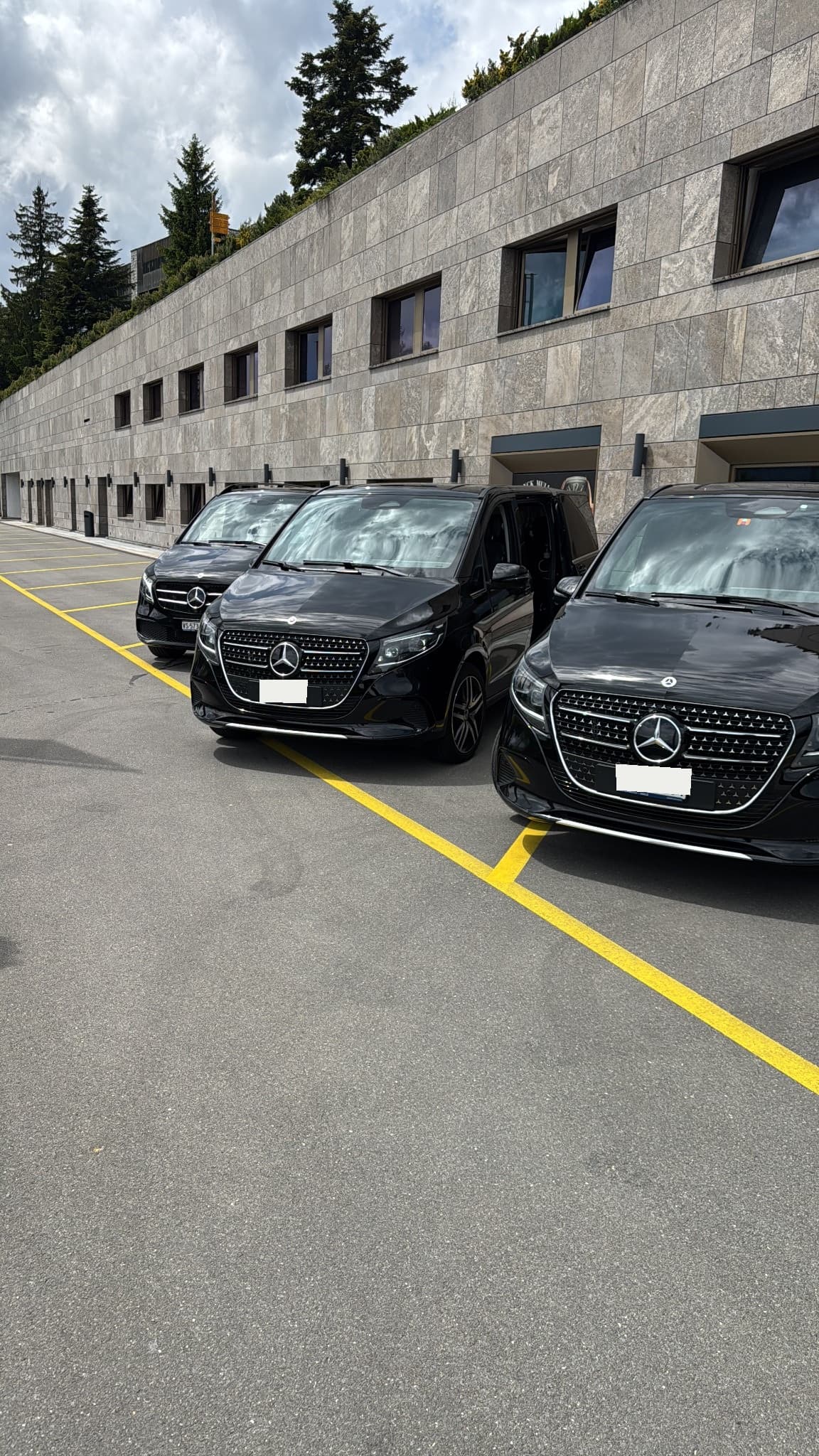 A fleet of executive vehicles staged before a movement