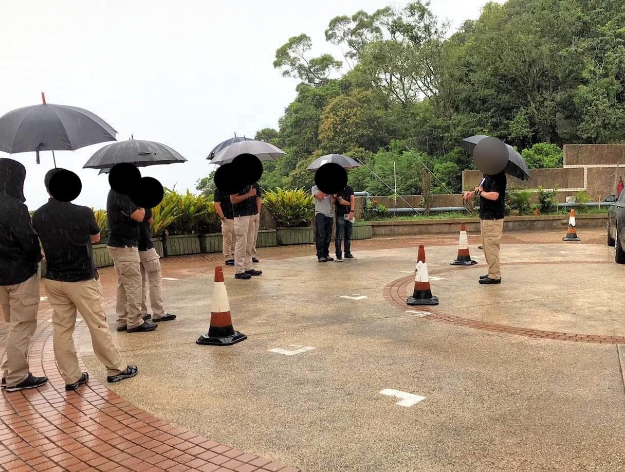 A team training on a marked circuit in the rain